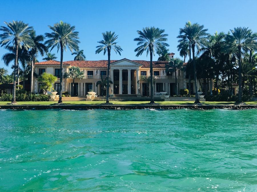 Waterfront estate behind palm trees on a Miami canal